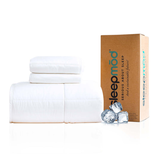 White folded blanket and shams with a cardboard box labeled 'sleepmod' on a white background